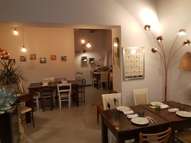 Azzighe  Osteria a metà